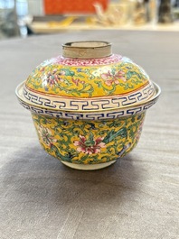 A pair of Chinese yellow-ground Canton enamel covered bowls and two cups, Yongzheng/Qianlong