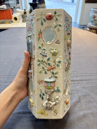 A pair of Chinese famille rose relief-moulded reticulated 'antiquities' hat stands, 19th C.