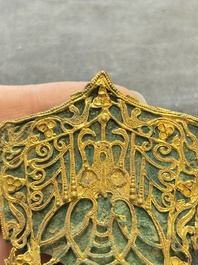 A fine Chinese gold and bronze plaque from a hat ornament, Wei/Jin