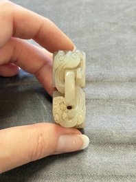A Chinese celadon and russet jade 'chilong' seal, 18/19th C.