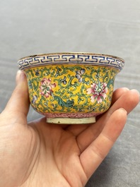 A pair of Chinese yellow-ground Canton enamel covered bowls and two cups, Yongzheng/Qianlong