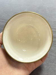 A pair of Chinese yellow-ground Canton enamel covered bowls and two cups, Yongzheng/Qianlong