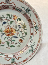 A Chinese Imari-style 'Lady and Boys' plate and a famille verte 'Lotus' plate, Kangxi/Yongzheng