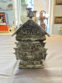 A Chinese archaic bronze inscribed wine vessel with buffalo design, 'fangyi 方彝', Western Zhou