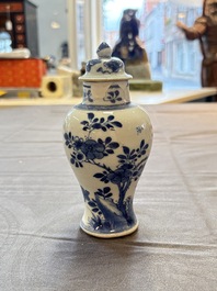 A varied collection of eight Chinese blue and white vases, two teapots and two loving cups, Kangxi/Qianlong