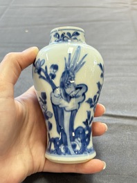 A varied collection of eight Chinese blue and white vases, two teapots and two loving cups, Kangxi/Qianlong