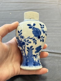 A varied collection of eight Chinese blue and white vases, two teapots and two loving cups, Kangxi/Qianlong