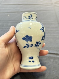 A varied collection of eight Chinese blue and white vases, two teapots and two loving cups, Kangxi/Qianlong