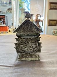 A Chinese archaic bronze inscribed wine vessel with buffalo design, 'fangyi 方彝', Western Zhou