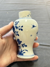 A varied collection of eight Chinese blue and white vases, two teapots and two loving cups, Kangxi/Qianlong