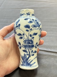 A varied collection of eight Chinese blue and white vases, two teapots and two loving cups, Kangxi/Qianlong