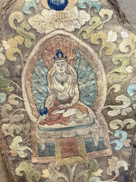 A framed Tibetan silk-embroidered four-leaf ritual crown with Transcendent Buddhas, 18th C.