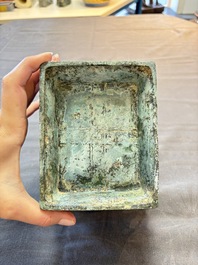 A Chinese archaic bronze inscribed wine vessel with buffalo design, 'fangyi 方彝', Western Zhou