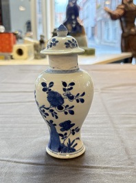 A varied collection of eight Chinese blue and white vases, two teapots and two loving cups, Kangxi/Qianlong