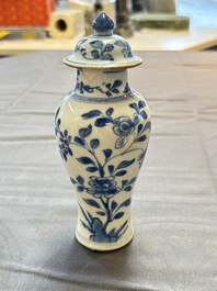 A varied collection of eight Chinese blue and white vases, two teapots and two loving cups, Kangxi/Qianlong