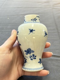 A varied collection of eight Chinese blue and white vases, two teapots and two loving cups, Kangxi/Qianlong