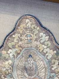 A framed Tibetan silk-embroidered four-leaf ritual crown with Transcendent Buddhas, 18th C.
