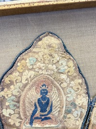 A framed Tibetan silk-embroidered four-leaf ritual crown with Transcendent Buddhas, 18th C.