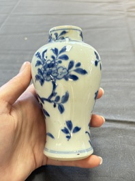 A varied collection of eight Chinese blue and white vases, two teapots and two loving cups, Kangxi/Qianlong
