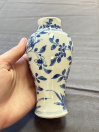 A varied collection of eight Chinese blue and white vases, two teapots and two loving cups, Kangxi/Qianlong