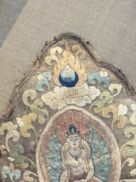 A framed Tibetan silk-embroidered four-leaf ritual crown with Transcendent Buddhas, 18th C.