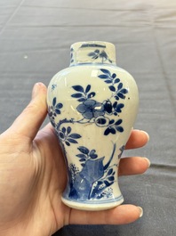 A varied collection of eight Chinese blue and white vases, two teapots and two loving cups, Kangxi/Qianlong