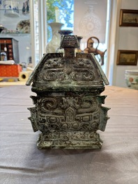 A Chinese archaic bronze inscribed wine vessel with buffalo design, 'fangyi 方彝', Western Zhou