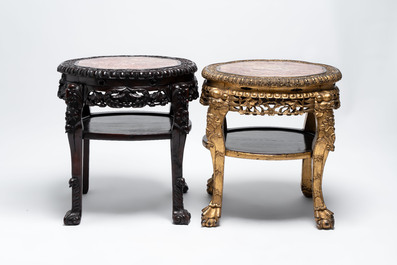Two Chinese marble-topped hongmu two-tier stands, one with later gilding, 19/20th C.