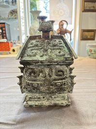 A Chinese archaic bronze inscribed wine vessel with buffalo design, 'fangyi 方彝', Western Zhou
