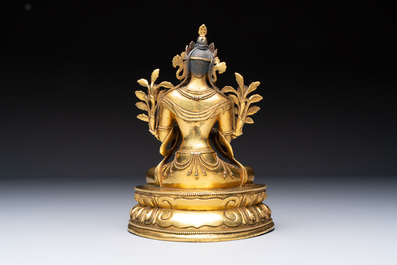 A fine Sino-Tibetan turquoise- and coral-inlaid gilt-bronze Buddha Maitreya, Kangxi