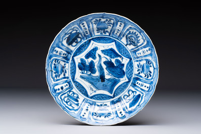 Two Chinese blue and white 'kraak' dishes and four plates, Wanli
