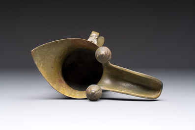 A Chinese archaic bronze wine vessel, 'jue 爵', late Shang