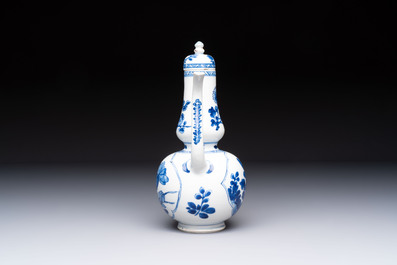 A Chinese blue and white ewer and cover with floral design, Kangxi