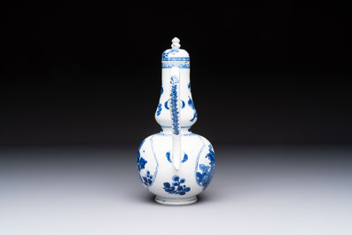A Chinese blue and white ewer and cover with floral design, Kangxi