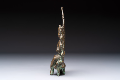 A Tibetan or Nepalese bronze seated Tara holding a vajra, 12/13th C.