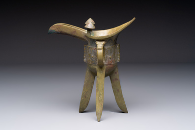 A Chinese archaic bronze wine vessel, 'jue 爵', late Shang