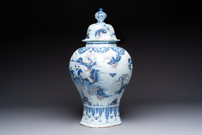 An exceptional blue, white and manganese Dutch Delft Transitional style chinoiserie vase and cover, 17th C.