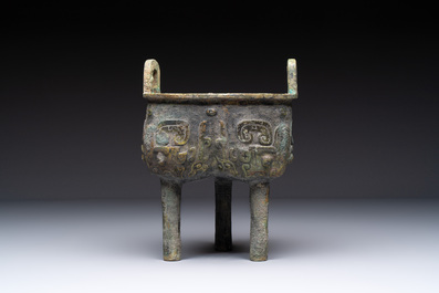 A Chinese archaic bronze food vessel with Taotie design, 'Ding 鼎', late Shang