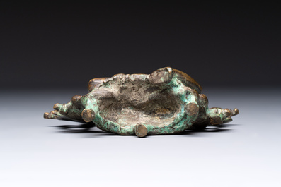 A Tibetan or Nepalese bronze seated Tara holding a vajra, 12/13th C.