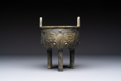 A Chinese archaic bronze food vessel with Taotie design, 'Ding 鼎', late Shang