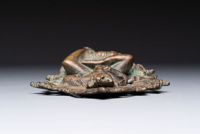 A Tibetan or Nepalese bronze seated Tara holding a vajra, 12/13th C.