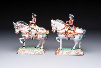 A pair of polychrome Dutch Delft petit feu models of horses with riders, 18th C.