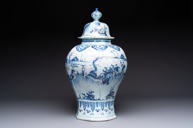 An exceptional blue, white and manganese Dutch Delft Transitional style chinoiserie vase and cover, 17th C.