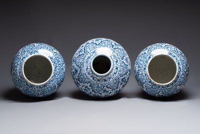 An exceptional large blue and white Dutch Delft garniture of three vases, late 17th/early 18th C.