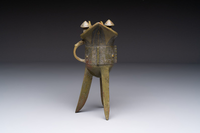 A Chinese archaic bronze wine vessel, 'jue 爵', late Shang