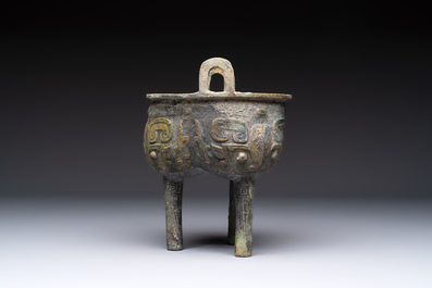 A Chinese archaic bronze food vessel with Taotie design, 'Ding 鼎', late Shang