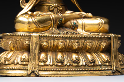 A fine Sino-Tibetan turquoise- and coral-inlaid gilt-bronze Buddha Maitreya, Kangxi