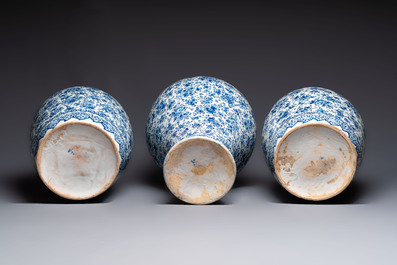 An exceptional large blue and white Dutch Delft garniture of three vases, late 17th/early 18th C.