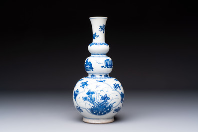 A Chinese blue and white double gourd 'Antiquities' vase, Kangxi