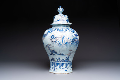 An exceptional blue, white and manganese Dutch Delft Transitional style chinoiserie vase and cover, 17th C.